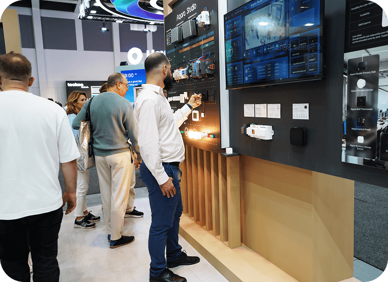 people playing with Aqara products at IFA 2026